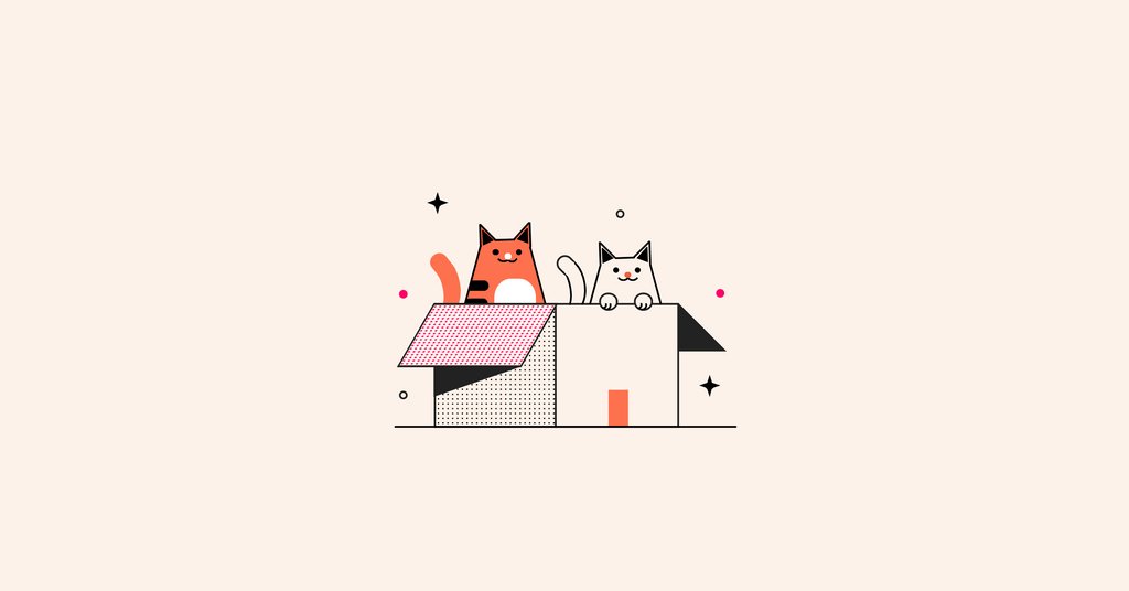 Two cats playing in a carboard box
